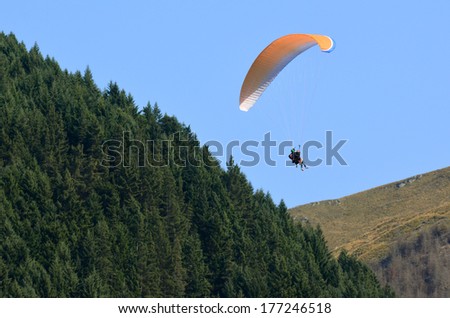 QUEENSTOWN, NZ - JAN 18:Paragliding in Queenstown NZ on Jan 18 2014. Launching from the skyline gondola it\'s the only fly over spectacular Queenstown and Lake Wakitipu.