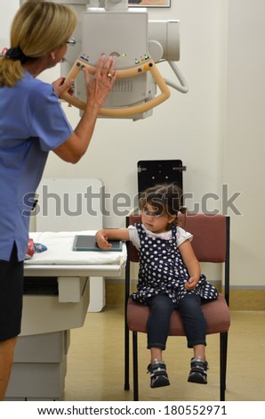 KAITAIA, NZ - MAR 06:Little girl (Talya Ben-Ari age 3)during X-ray radiography on Mar 06 2014.X-ray technology is a key element in identification, diagnosis,treatment of many medical conditions.