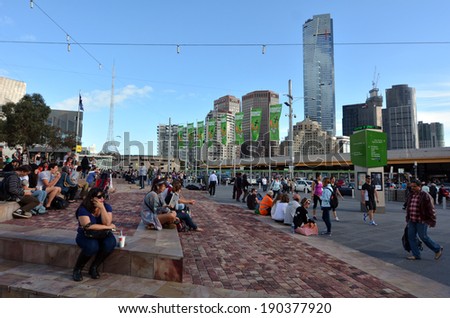 MELBOURNE - APR 13 2014:Visitors at the Federation Square.It located at the heart of MelbourneÃ?Â??s CBD with size of an entire city block.It\'s home to major cultural attractions and world-class events.