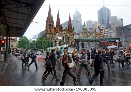MELBOURNE, AUS - APR 10 2014:Traffic on Swanston Street and Federation Square.Melbourne have population and employment growth with international investment in the city's industries and property market