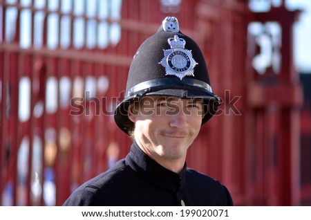AUCKLAND - JUNE 01 2014:New Zealander dressed as a British Police Officer celebrate the Queen\'s Birthday on first Monday of June each year as the Queen of the United Kingdom being the head of state
