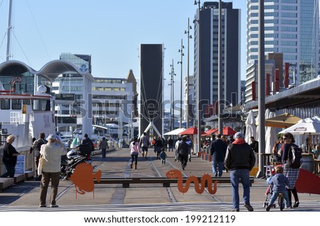 AUCKLAND - JUNE 01 2014:Visitors in Auckland Wynyard Quarter. Auckland has been rated one of the world\'s top 10 cities to visit by travel bible Lonely Planet.