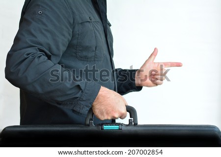 Man carry travel suitcase against white background with copy space. Concept photo of travel, vacation, holiday, destination, tourism, traveler, tourist.