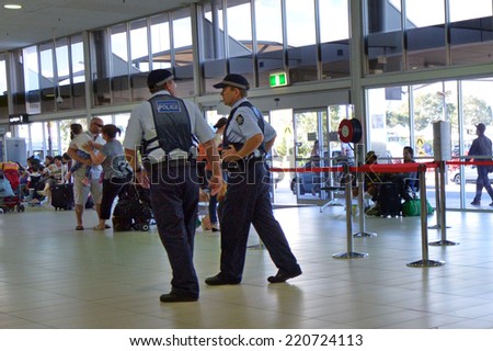 COOLANGATTA, AUS - SEP 25 2014:Police officers in Coolangatta Airport.Gold Coast police on high terror alert warned to be hyper vigilant and patrol local mosques and critical infrastructure sites