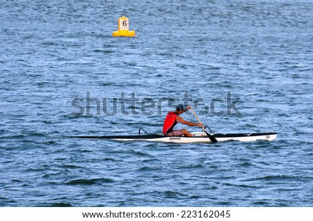 GOLD COAST - OCT 08 2014:Australian man sea kayaking.It's a very popular sport in the waterway of the Gold Coast in Queensland, Australia.