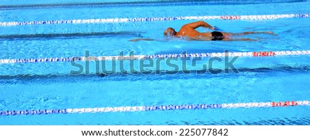 Unrecognized person swim in swimming pool. Background texture. concept photo water, sport, swimming.