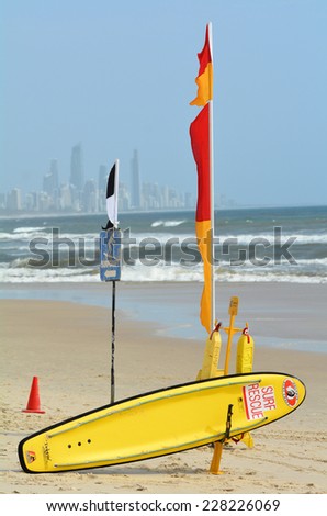 GOLD COAST, AUS - NOV 02 2014:Australian Lifeguards Beach Safety Flags and equipment against Surfers Paradise skyline in Gold Coast Queensland Australia.