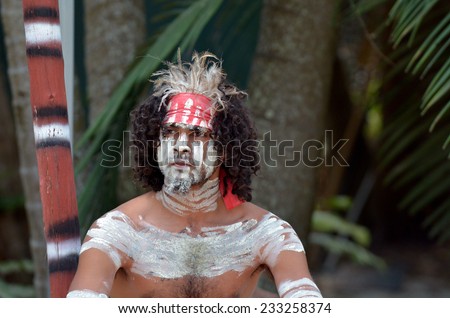 Portrait of one Yugambeh Aboriginal warrior man covered with body painting during Aboriginal culture show in Queensland, Australia.