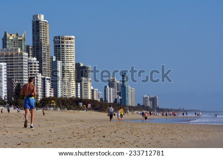 SURFERS PARADISE - NOV 14 2014:Visitors on main beach in Surfers Paradise.It one of Australia's iconic coastal tourist destinations, drawing 10 million tourists every year from all over the world.