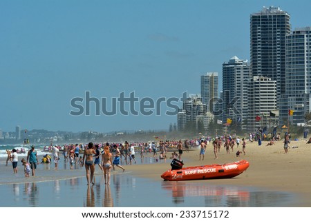 SURFERS PARADISE - NOV 08 2014:Visitors on main beach in Surfers Paradise.It one of Australia\'s iconic coastal tourist destinations, drawing 10 million tourists every year from all over the world.