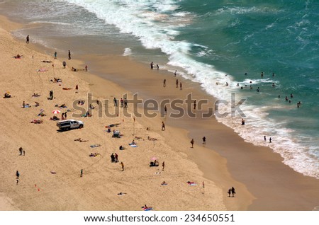 SURFERS PARADISE - NOV 08 2014:Visitors on main beach in Surfers Paradise.It one of Australia\'s iconic coastal tourist destinations, drawing 10 million tourists every year from all over the world.