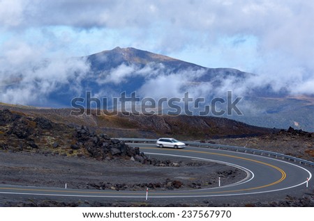 NATIONAL PARK, NZ - NOV 25 2014:Car drive through Tongariro National Park.About 1M people visit the park every year, doing hiking and climbing in summer, and skiing and snowboarding in winter.