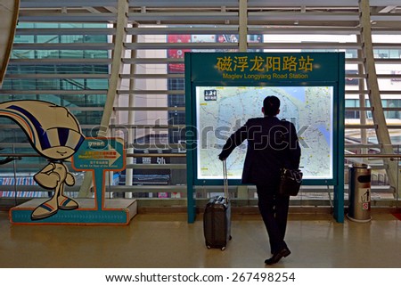 SHANGHAI, CN - MAR 15 2015:Passenger on the way to Shanghai Maglev Train. The line is the first commercially operated high-speed magnetic levitation line in the world