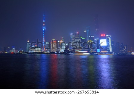 SHANGHAI, CN - MAR 15 2015:Pudong New Area skyline in Shanghai, China at night.It\'s home to the Lujiazui Finance and Trade Zone, Shanghai Stock Exchange and many of Shanghai\'s best-known buildings.