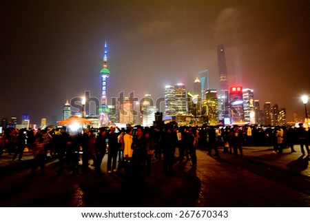 SHANGHAI, CN - MAR 15 2015:Pudong New Area skyline in Shanghai, China at night.It\'s home to the Lujiazui Finance and Trade Zone, Shanghai Stock Exchange and many of Shanghai\'s best-known buildings.