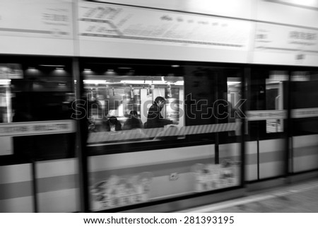 SHANGHAI, CH - MAR 25 2015:Passengers in Shanghai Metro train station. Shanghai Metro ranks third in the world in annual ridership, with 2.5 billion rides delivered in 2013.