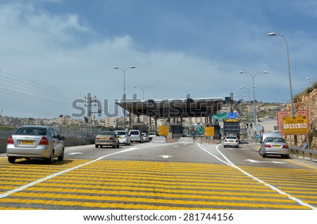 JERUSALEM - MAR 19 2015:Israel Border Police checkpoint to Jerusalem from Maale adumim. The barrier erected by the IDF with the stated aim of enhancing the security of Israel and Israeli settlements.
