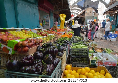 ACRE, ISRAEL - APR 21 2015:People shopping at acre old market in Akko, Israel. Acre is one of the oldest continuously inhabited sites in the world.