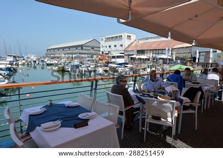TEL AVIV, ISRAEL - MAR 24 2015:People dinning at the old port of Jaffa in Tel Aviv Jaffa, Israel.It\'s ancient port city in Israel famous for its beauty and ancient history.