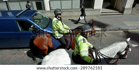 LONDON - MAY 12 2015:Metropolitan Police Service Mounted officers.Police across Britain have been put on high alert and warned that they may be targeted in terror attacks