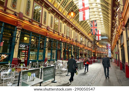 LONDON - MAY 13 2015:Pedestrians in Leadenhall Market in London, UK.It\'s one of the oldest markets in London, dating back to the 14th century, located in the historic centre of the City of London.