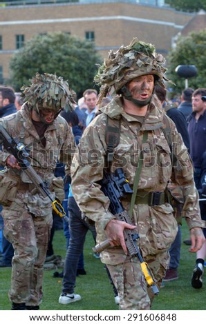 LONDON - MAY 14 2015:British Army soldiers.According to Ministry of Defence, it costs Ã?Â£30,000 to train a soldier. Selection costs Â£7,000, while Basic Training and Combat Infantry Course cost Â£23,000.