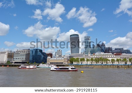 LONDON, UK - MAY 13 2015:The skyline of city of London from London River Thames. The City of London, know simply as \'the City\' which is the business and financial heart of the United Kingdom.