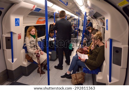 LONDON, UK - MAY 15 2015:Passengers travel on  London Underground. The Annual passenger numbers of london Underground  \
is 1.265 billion
