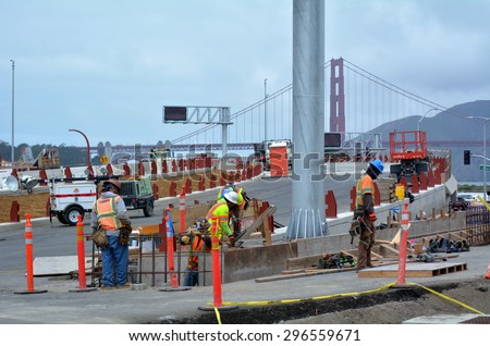 SAN FRANCISCO - MAY 21 2015:Road workers of San Francisco parkway tunnels at work.The Presidio Parkway is a regional gateway between the iconic Golden Gate Bridge and the city of San Francisco.