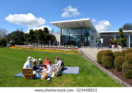 AUCKLAND,  NZL -  OCT 01 2015: Visitors having picnic at Auckland Botanic Gardens. It opened to the public in 1982 and holds more than 10,000 plants from all over the world..