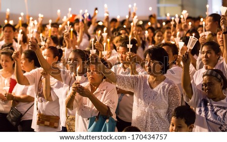 Bangkok - 09 JAN : Group of people in white informal suit lighting a candle for show the symbol about the respect for vote election on 2 February 2014. On January 09, 2014 in Bangkok, Thailand