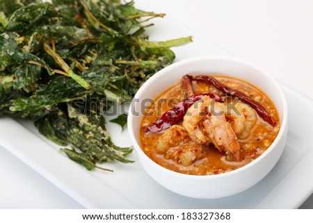 Boiled water spinach served with spicy sauce on white dish