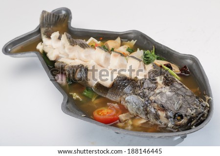 Spicy boiled fish in fish shaped bowl