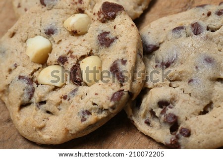 Chocolate chip cookies on wooden cutting board