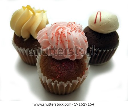 Three mini cupcakes with frosting