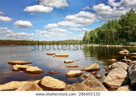 Stones on a lake surface. A lake on Suna river, Karelia, Russia.