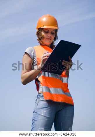 young girl with a helmet and emergency vest