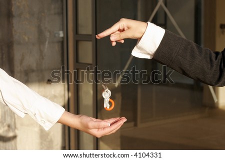 businessman passing the key to success