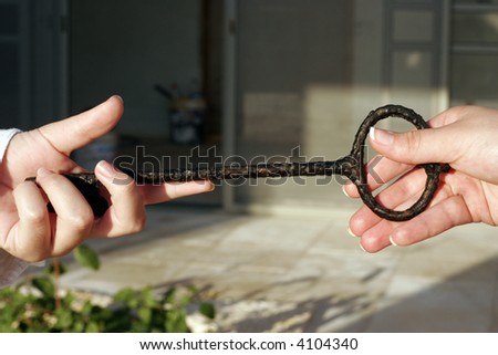 businessman passing the key to success