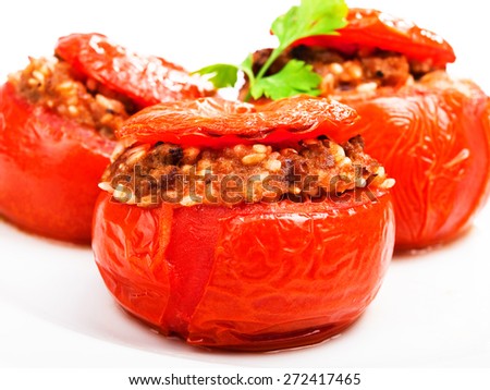 Stuffed tomato with meat and rice isolated on white background