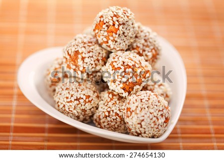 Homemade healthy candies made of dried apples and sesame
