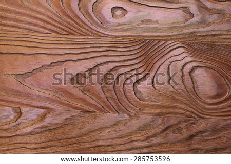 Old rich brown wood grain texture background with knots