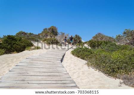 Wooden path at Chrissi island. White sand