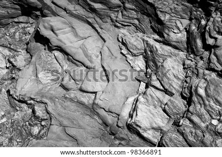 Black & White image of natural slate with strong shadows.