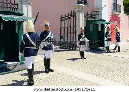 LISBON - JUNE 2: The Changing Guard Ceremony takes place in Palace of Belem on June 2, 2013 in Lisbon, Portugal. The ceremony is performed in every Sunday in the summer months.