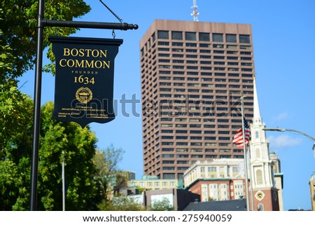 BOSTON - OCT 2: Sign of Boston Common, with the Park Street Church and Boston skyline on the background on October 2, 2013 in Boston, Massachusetts, USA.