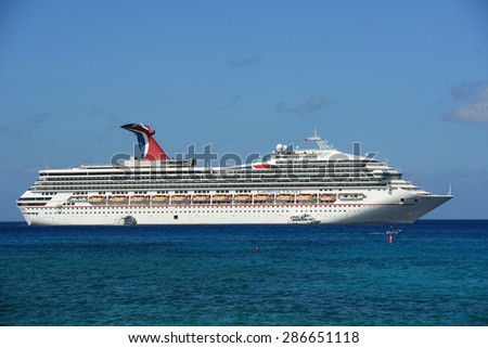 CAYMAN ISLANDS - DEC 30: Carnival Cruise ship Victory anchore offshore on December 30th, 2014 in George Town, Cayman Islands.