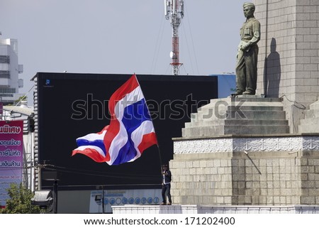BANGKOK - JANUARY 13 : Protesters against the government rally together near Victory Monument on January 13, 2014 in Bangkok, Thailand