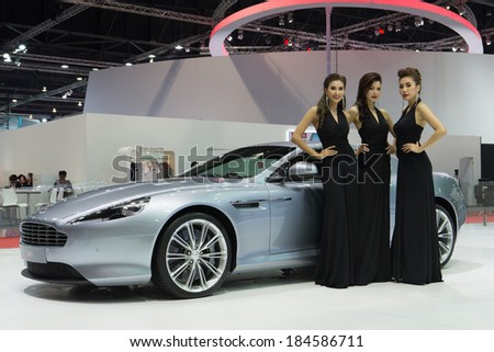 BANGKOK THAILAND-MARCH 25 : Unidentified models post with  Aston Martin The new DB9 displayed on stage at The 35th Bangkok International Motor Show 2014 on March 25, 2014 in Bangkok, Thailand.