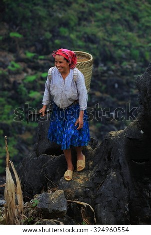 HAGIANG, VIETNAM - SEPTEMBER 19 : An unidentified woman hill tribes of Vietnam action action over high moutain on Sep. 2015, 19 in Hagiang, Vietnam. Hmong is hill tribes that live on the high mountain